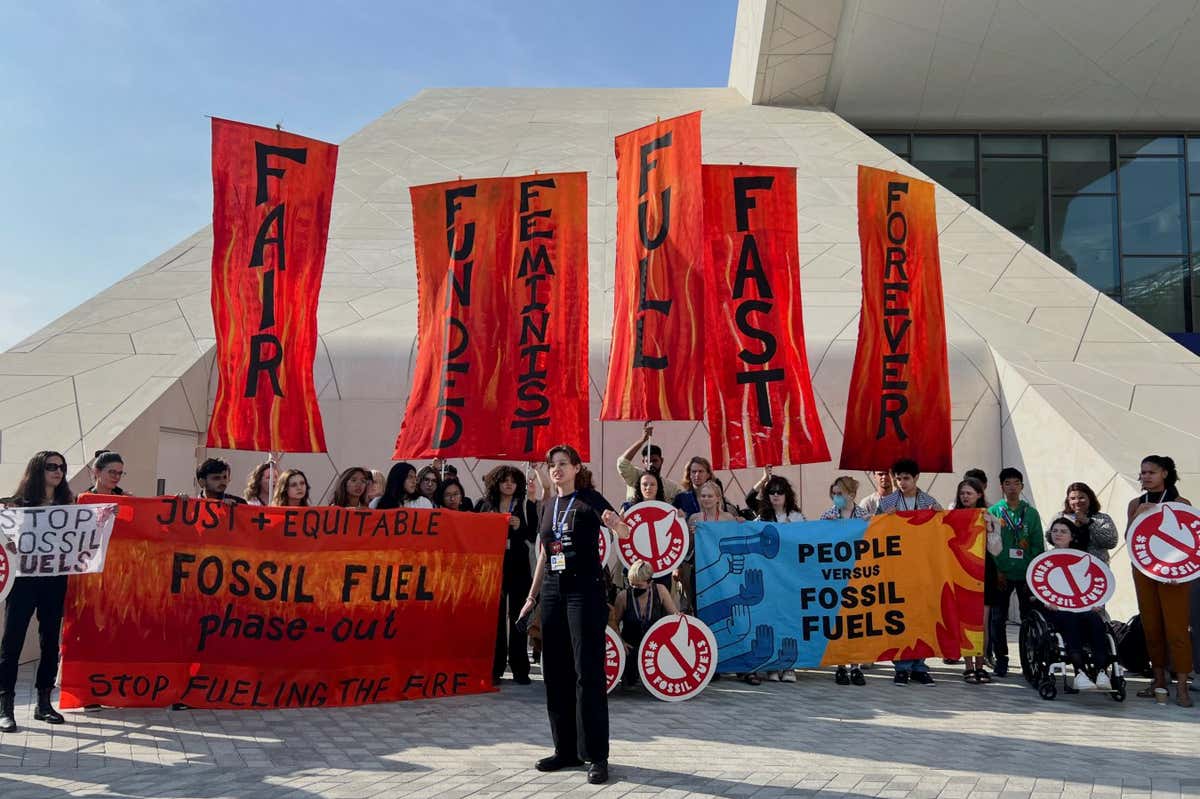 Climate activists protest after a draft of a negotiation deal was released, at the United Nations Climate Change Conference COP28 in Dubai, United Arab Emirates, December 13, 2023. REUTERS/Rula Rouhana - RC25W4A9Z99Q